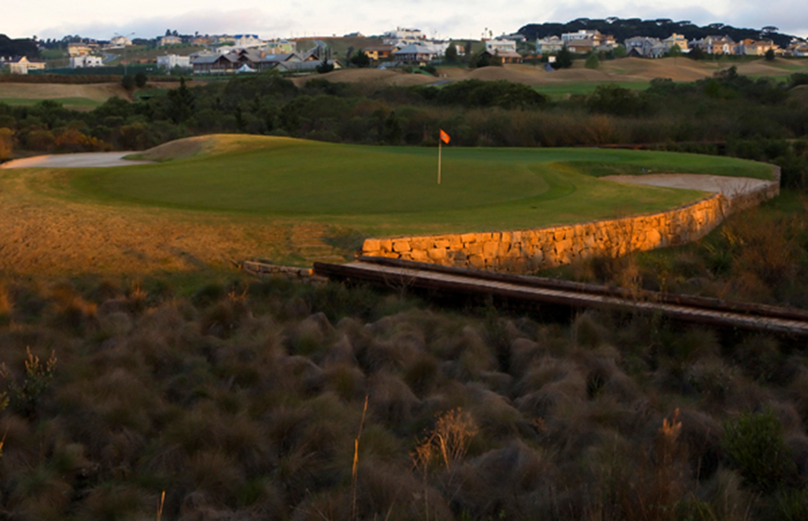 This short par four #7, is a fun birdie chance at Alphaville Graciosa in Curitiba, Parana if you can manage to make it safely onto this generous island green.